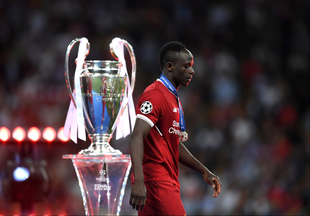 KIEV, UKRAINE - MAY 26: Sadio Mane of Liverpool walks past the trophy dejected after the UEFA Champions League Final between Real Madrid and Liverpool at NSC Olimpiyskiy Stadium on May 26, 2018 in Kiev, Ukraine. (Photo by Shaun Botterill/Getty Images)